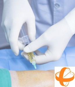 Male Traumatology and Orthopedics surgeon doctor injecting patient on hospital bed in knee in private clinic with PRP Platelet Rich PLasma Human Growth Factors Stem Cells to treat cartilage wastage joint injury and pain.